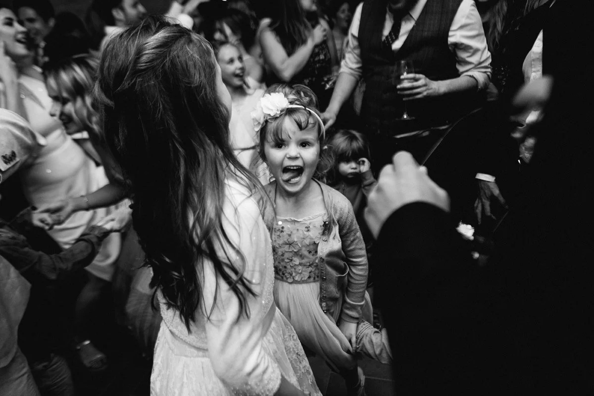 Flower girl dancing and having fun during the wedding party at Borgo Pietrafitta.