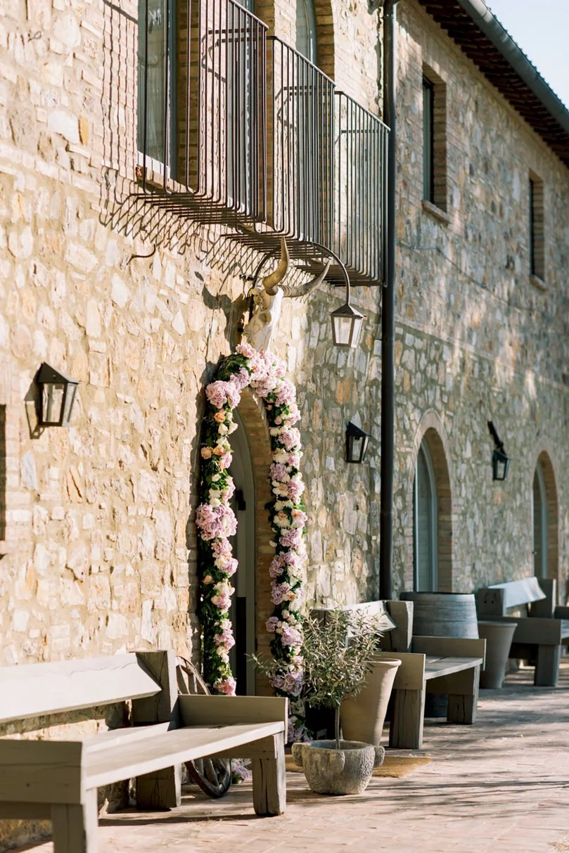 Entrance of Conti di San Bonifacio decorated with flowers for a wedding celebration.