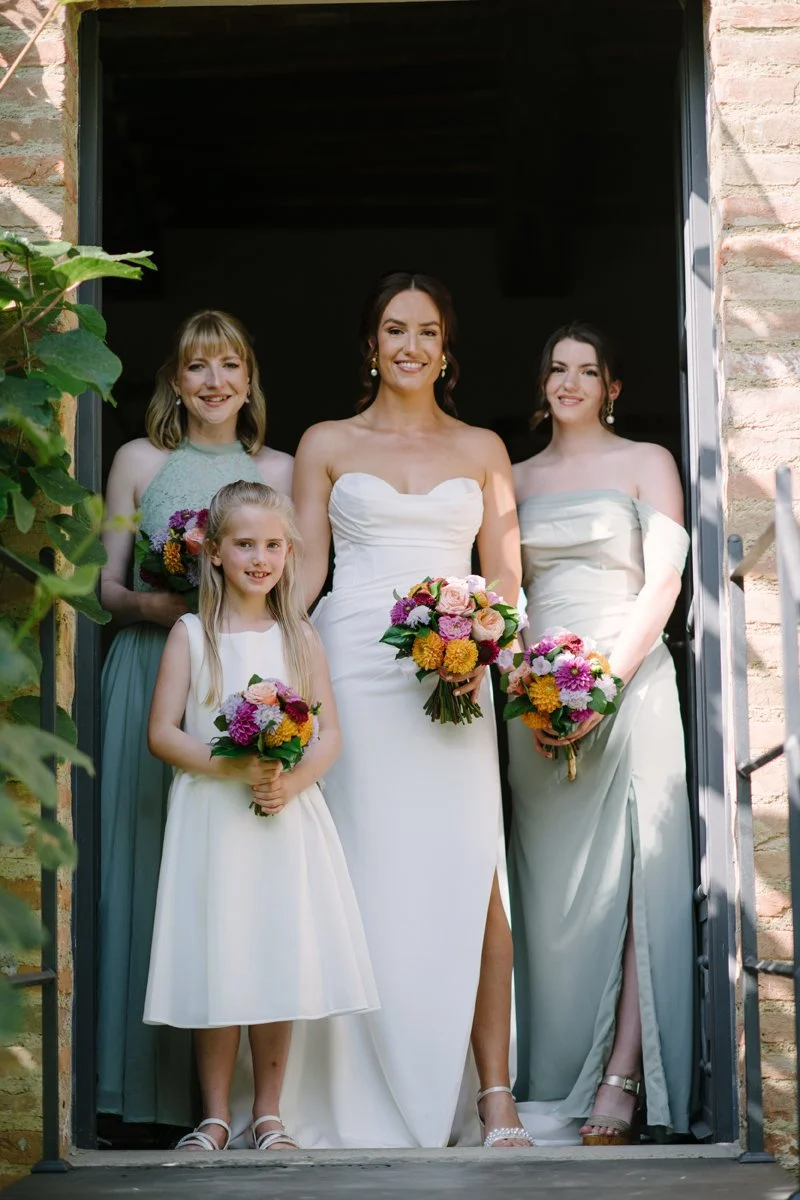 Bride with her bridesmaids and flower girl at Casa Cornacchi wedding in Tuscany Italy