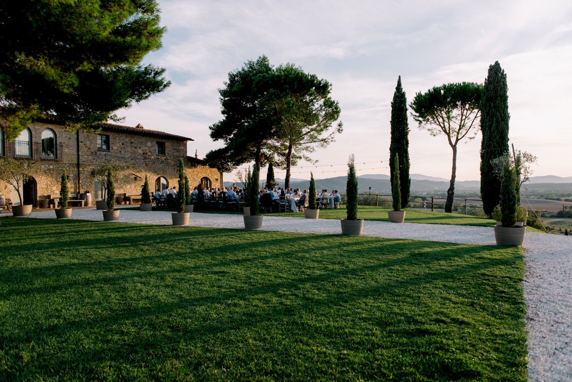 Full exterior view of Conti di San Bonifacio wine estate surrounded by the Tuscan countryside.