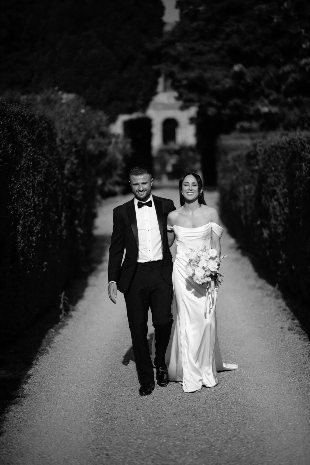 Black and white portrait of bride and groom in the formal gardens of Villa di Ulignano, October wedding by FunkyBird