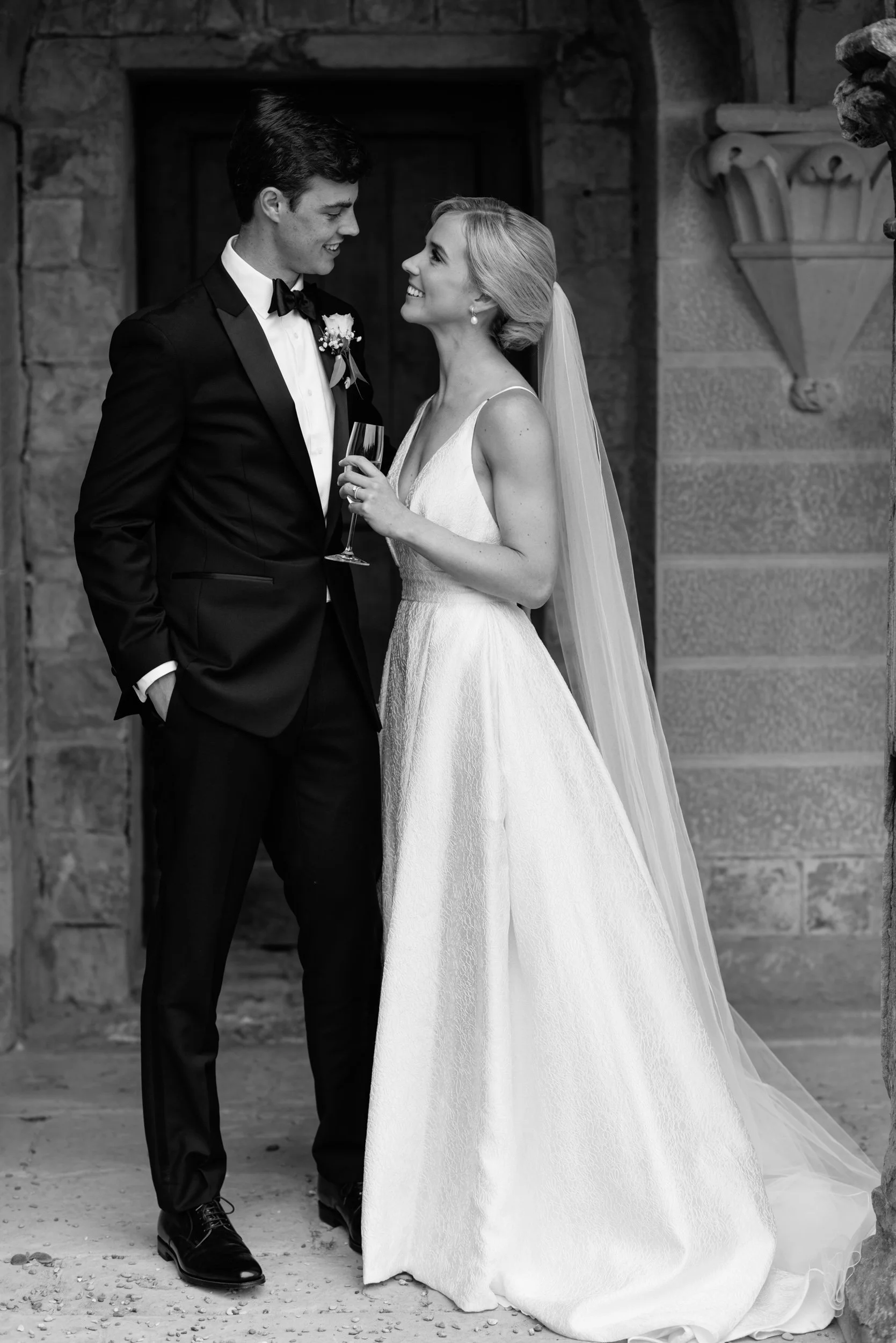 Black and white photograph of a couple looking at each other during a castle wedding in Florence, Tuscany