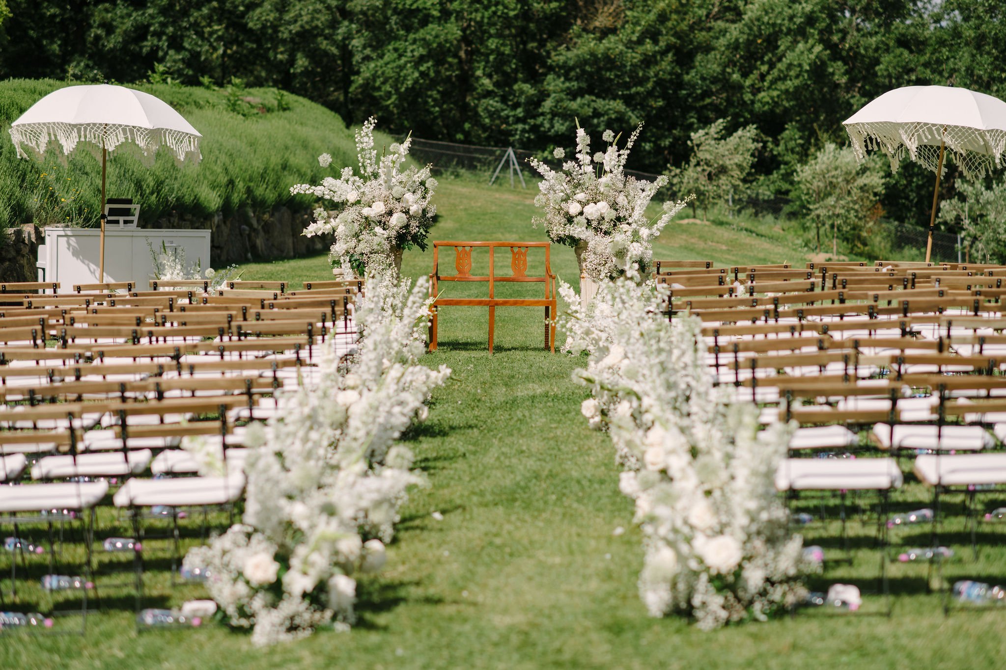 Wedding ceremony with beautiful flowers at wedding in Umbria by Wedding photographer from Tuscany