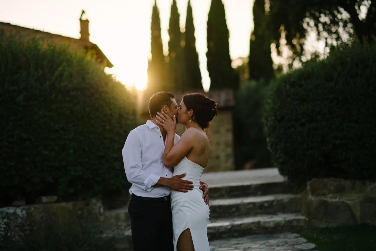 Couple kissing during sunset at Italian wedding