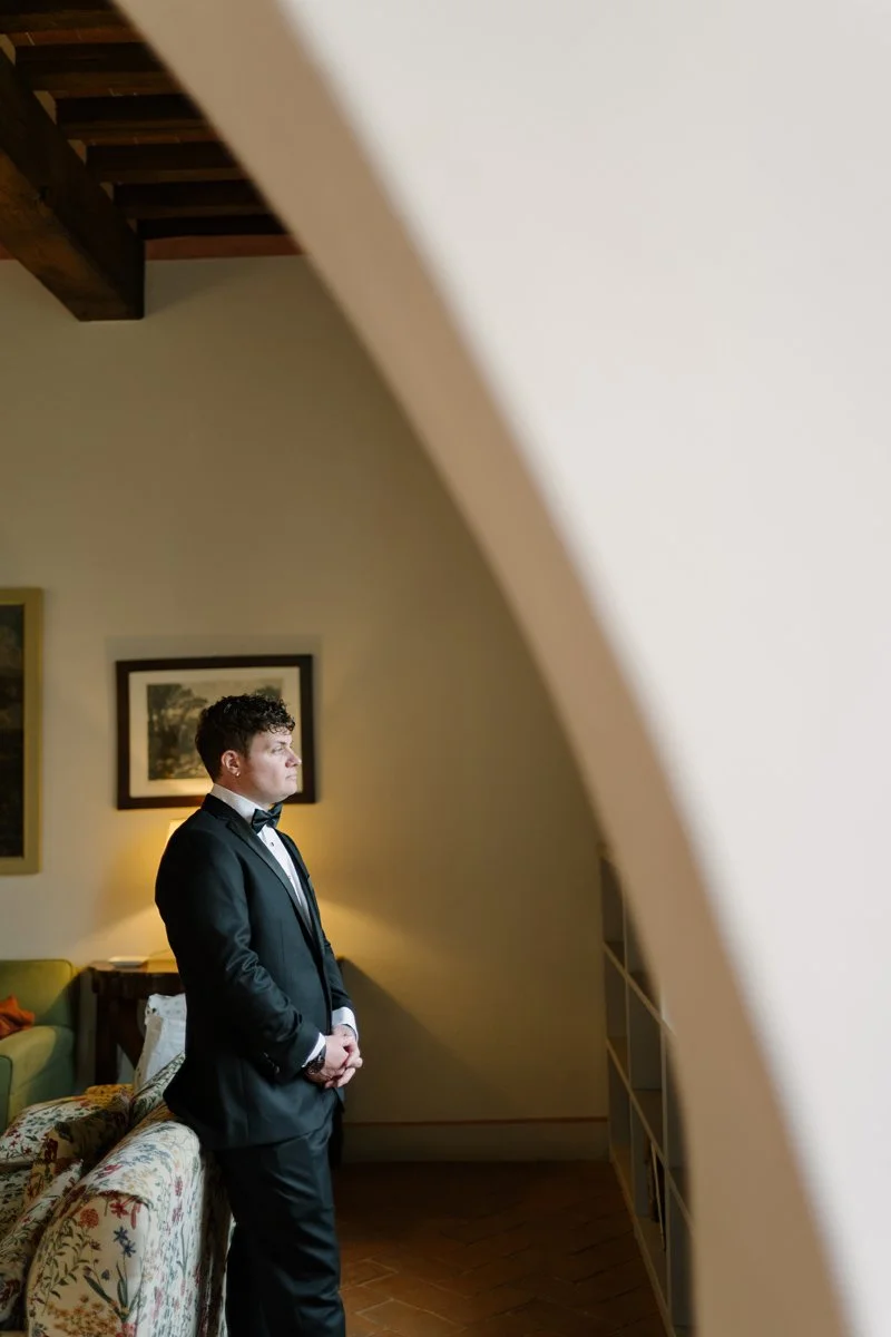 Beautiful portrait of the groom inside of the room at Castello di Celsa.