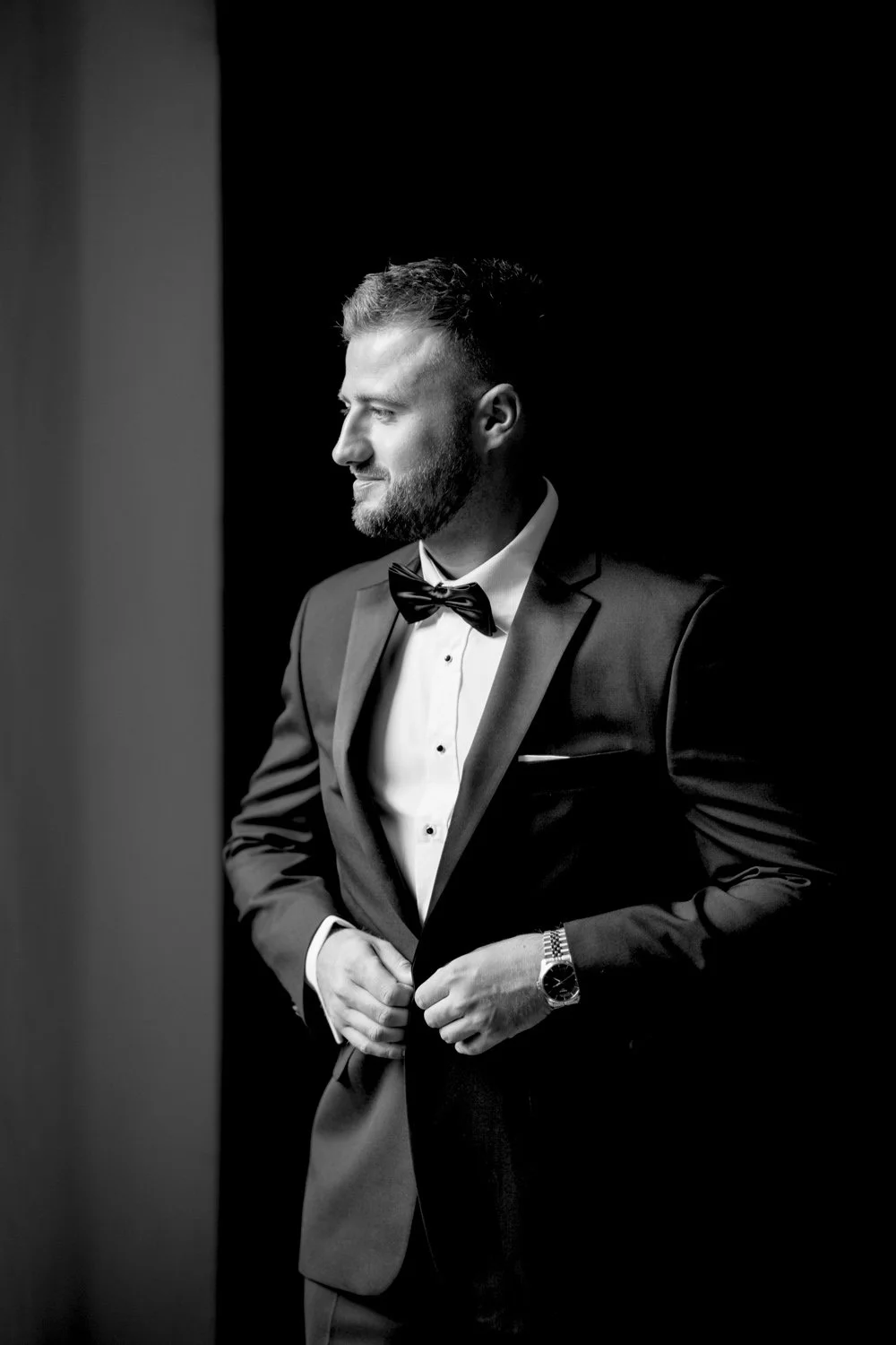 Groom adjusting his tuxedo before his October wedding at Villa di Ulignano, photographed by FunkyBird