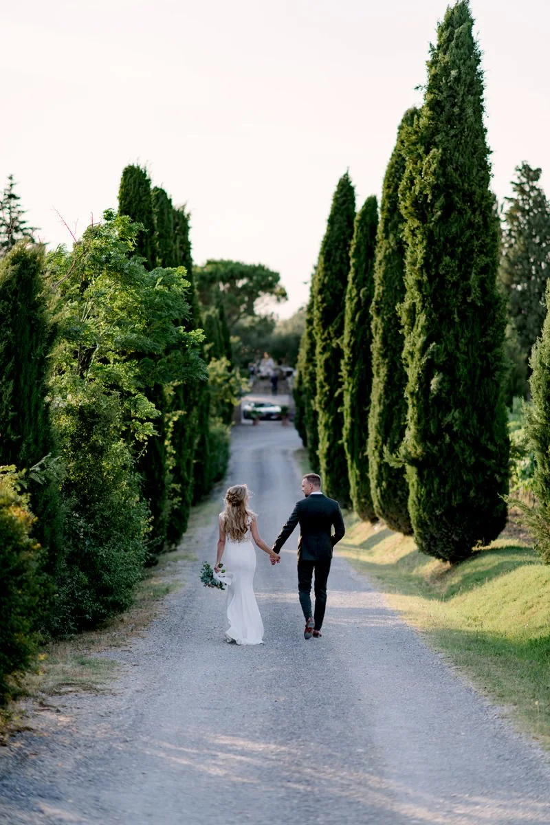 terre-di-nano-long-alley-tuscan-trees-couple-walking.jpg