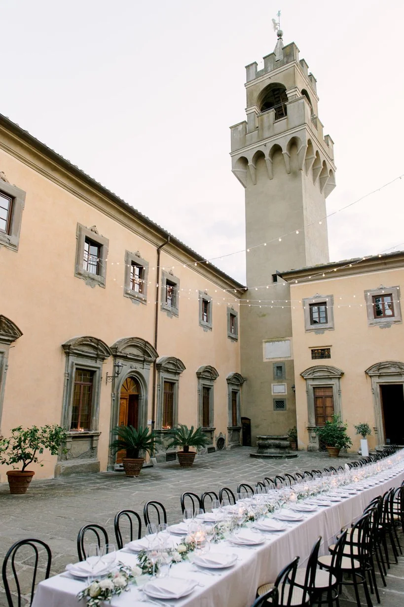 Evening view of Castello di Montegufoni from the wedding dinner area, with the castle view.