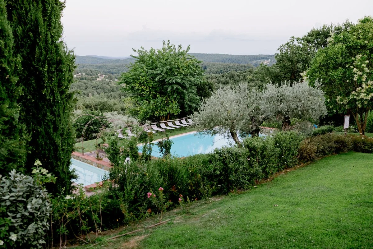Garden and swimming pool at Casa Cornacchi, a relaxed countryside wedding venue in Tuscany