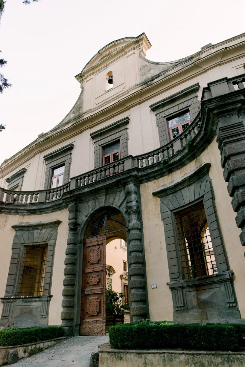 Main entrance of Castello di Montegufoni, photographed during a destination wedding in Tuscany.