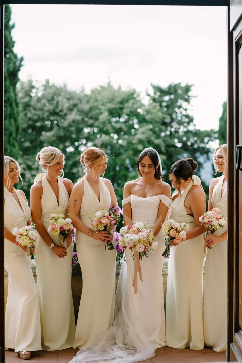 Bride with five bridesmaids on the front terrace of Villa di Ulignano before the ceremony, FunkyBird Photography