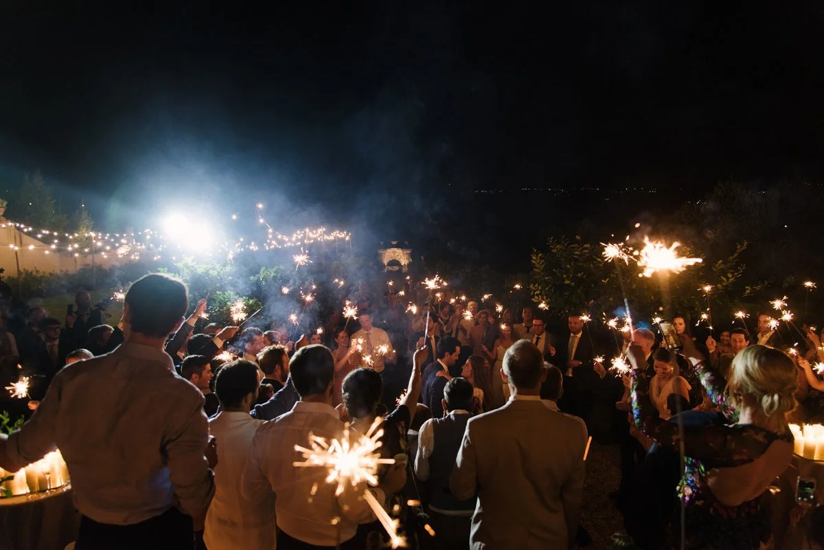 First dance outside Villa Medicea di Lilliano surrounded by guests holding sparklers