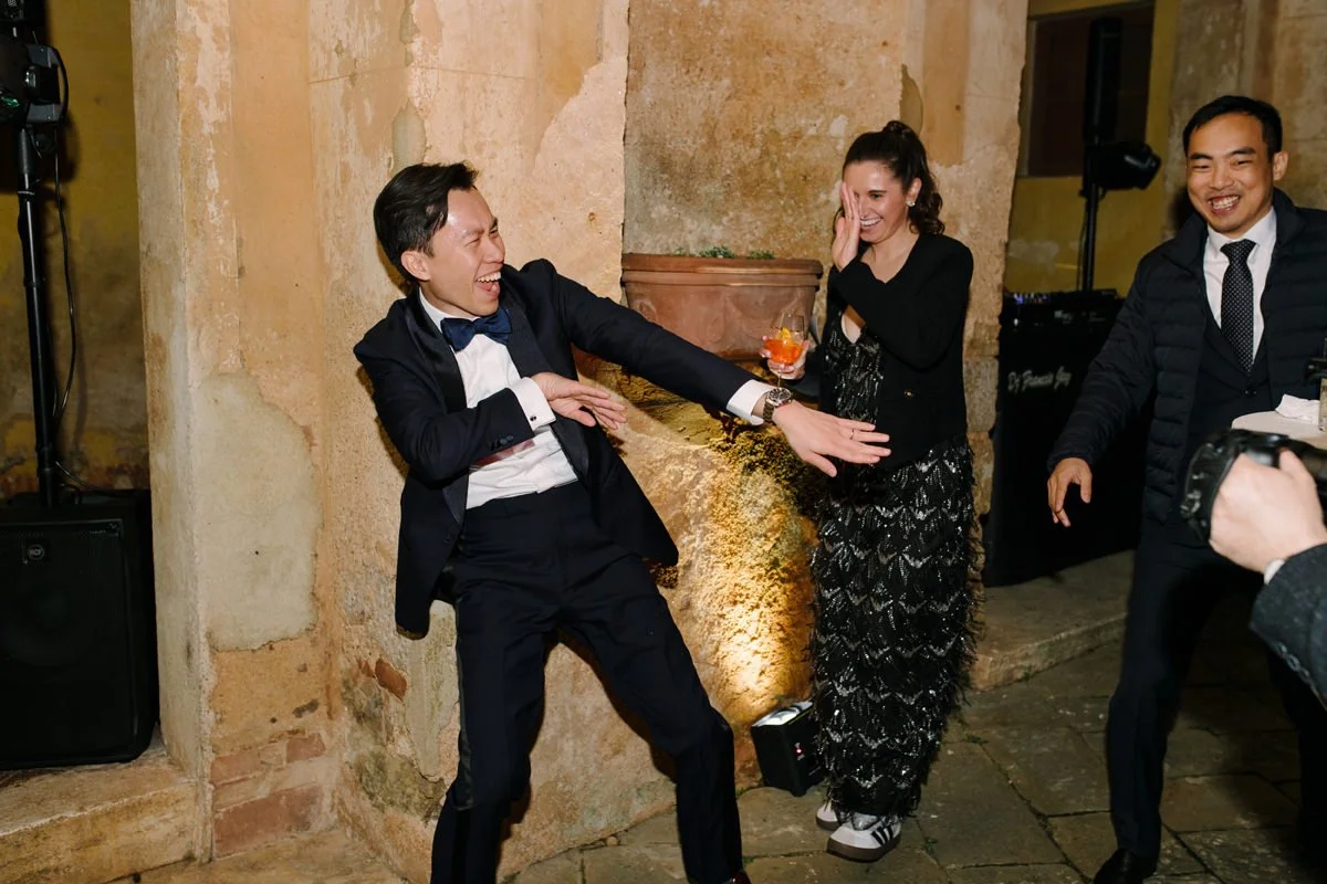 Wedding guests dancing and having fun.