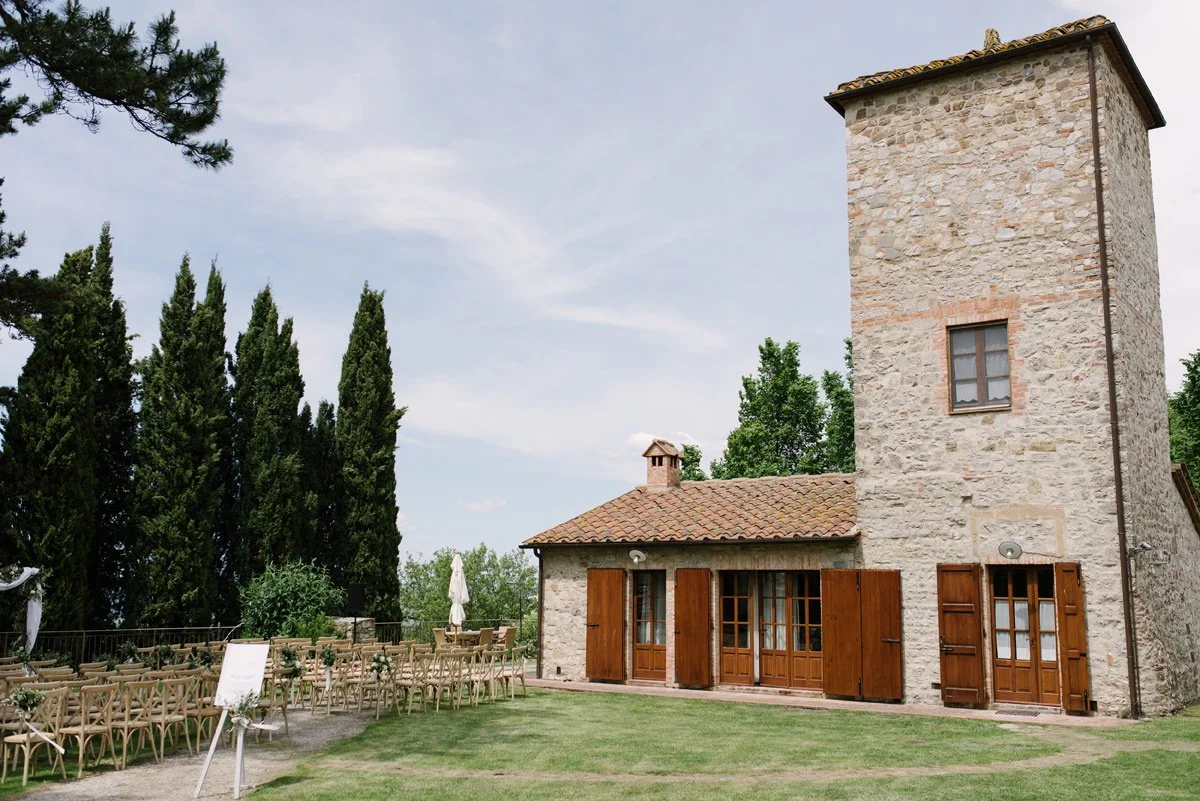 Historic stone house next to the wedding ceremony area at Borgo Pietrafitta in Tuscany.