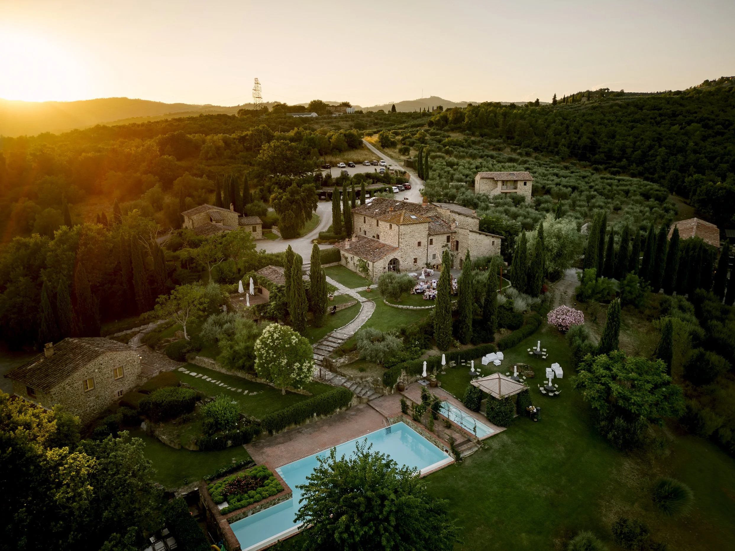 Drone view of Casa Cornacchi wedding venue in Tuscany showing the house, gardens, and surrounding countryside