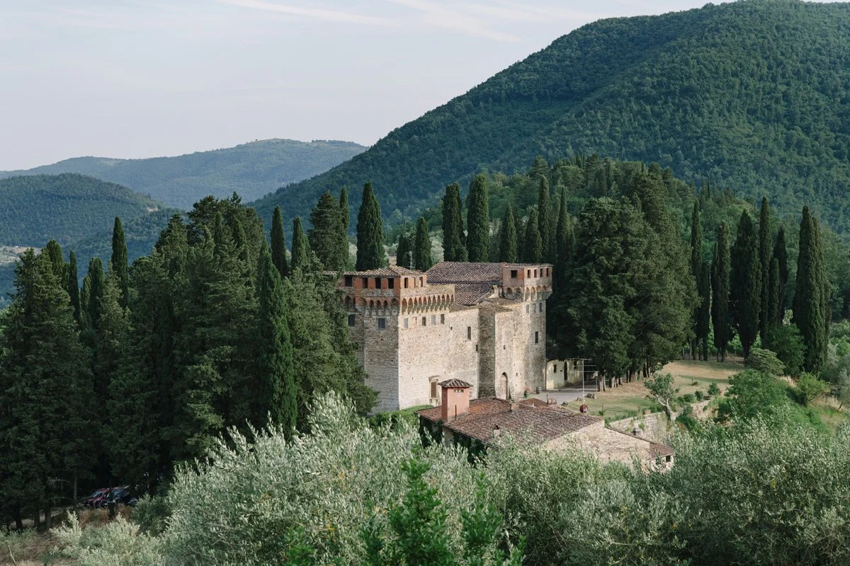 View at the Castello del Trebbio Tuscany wedding venue from distance .