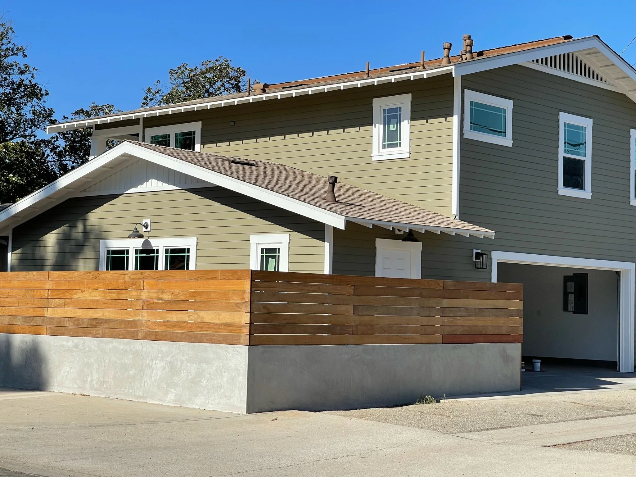 Custom detached ADU in historic district of Fullerton California with traditional architecture and modern backyard hardscape