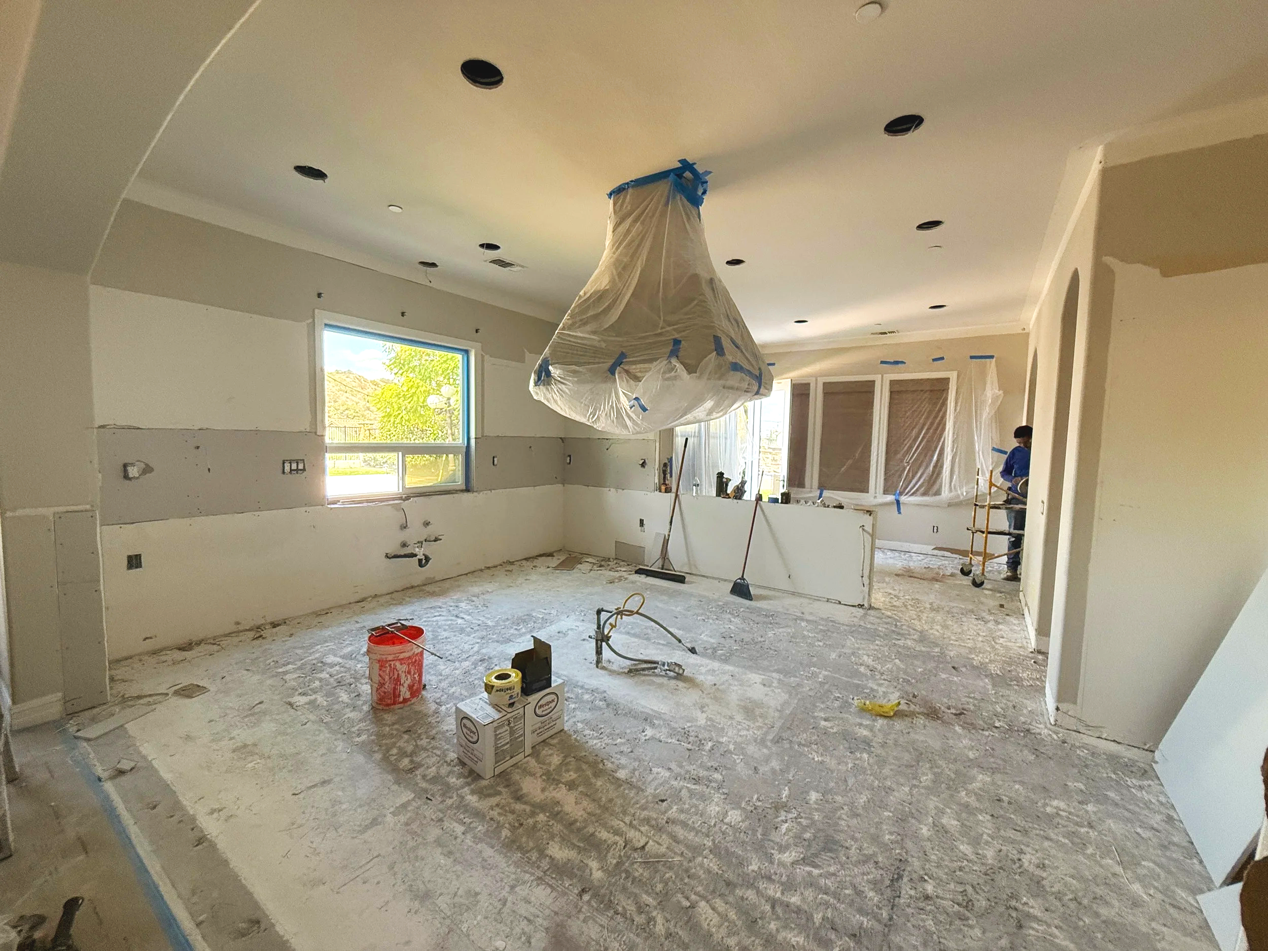 Active kitchen remodel construction site in Yorba Linda, California showing a clean and organized jobsite during renovation with protective coverings