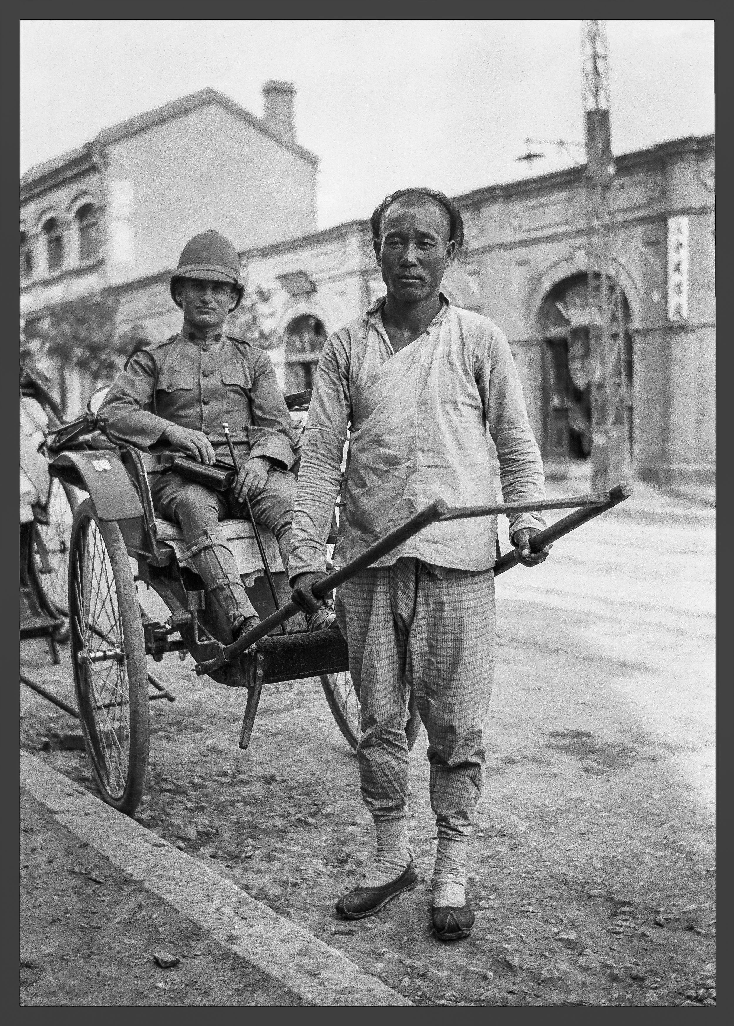 A rickshaw operator poses with his fare, which appears to be an officer.