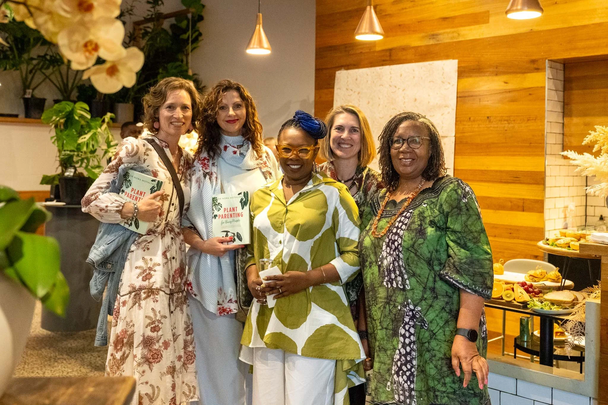 Nora's friends and family gather to celebrate the authors book launch