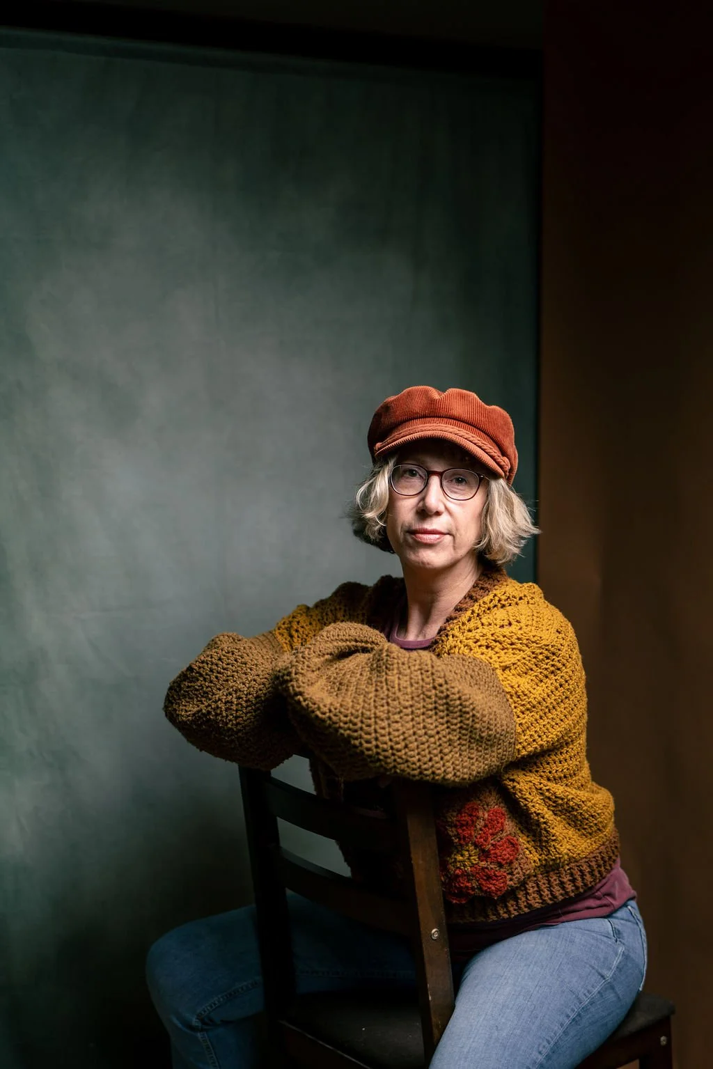 Pauline Klemm form Sliding Door Photography  sits on a chair for a portrait by GorakPhoto