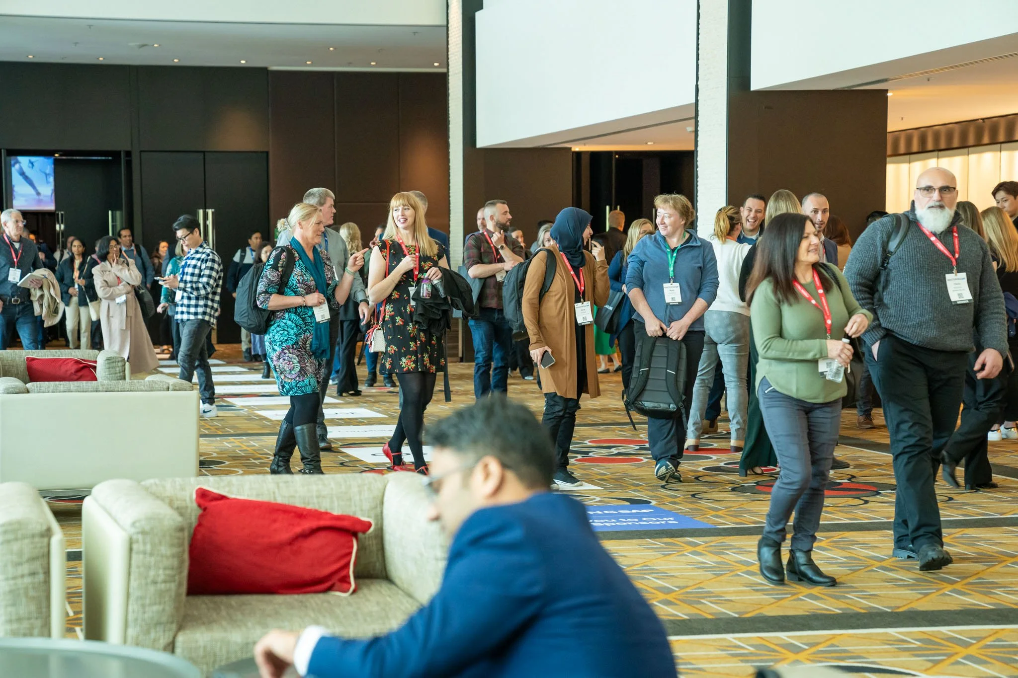 Members pictured leaving keynote sessions at Crown Promenade MasteringSAP 2024