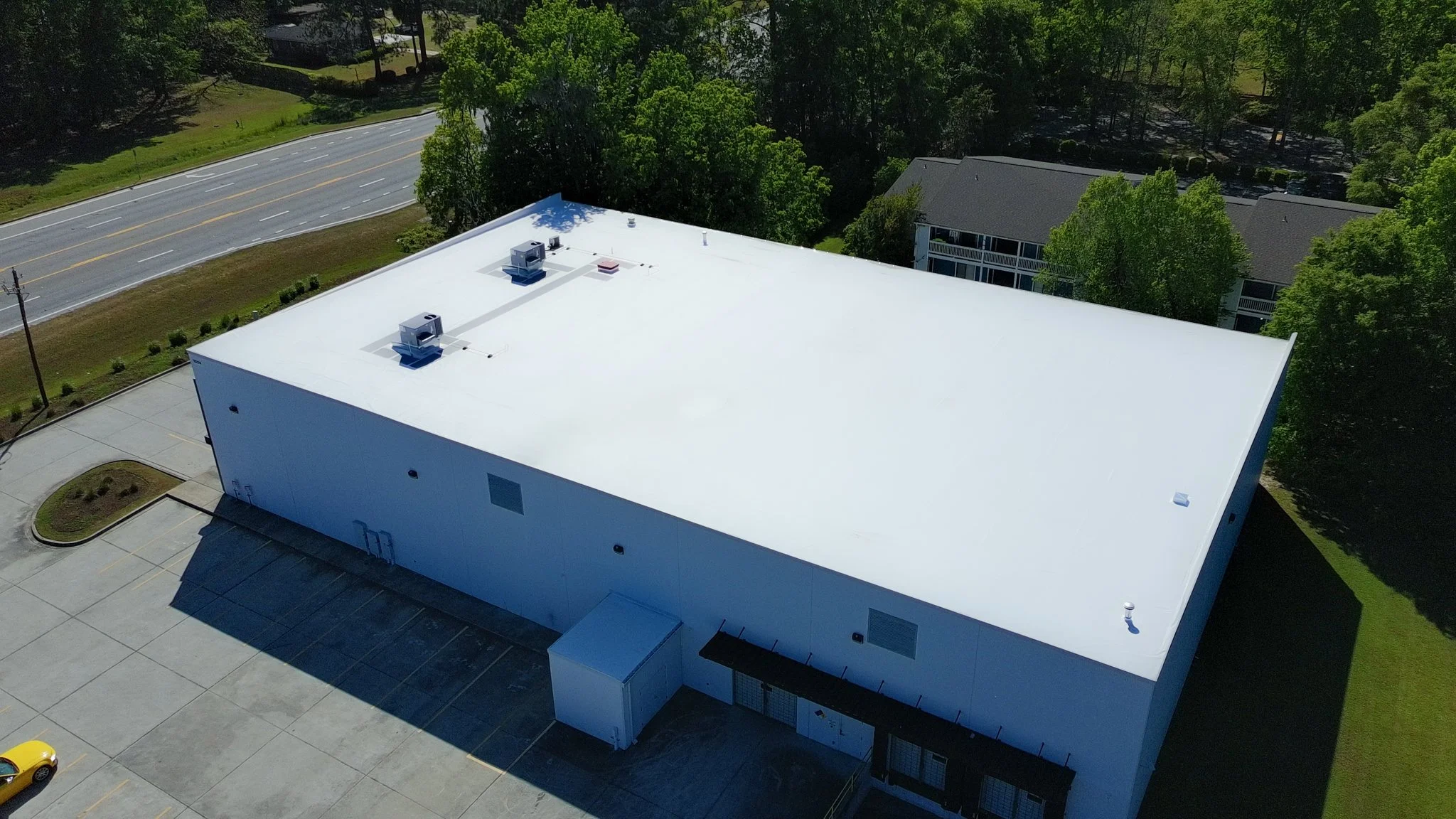 Commercial TPO roof replacement completed for an industrial warehouse, providing a durable, energy-efficient roofing system built for long-term performance and weather protection.