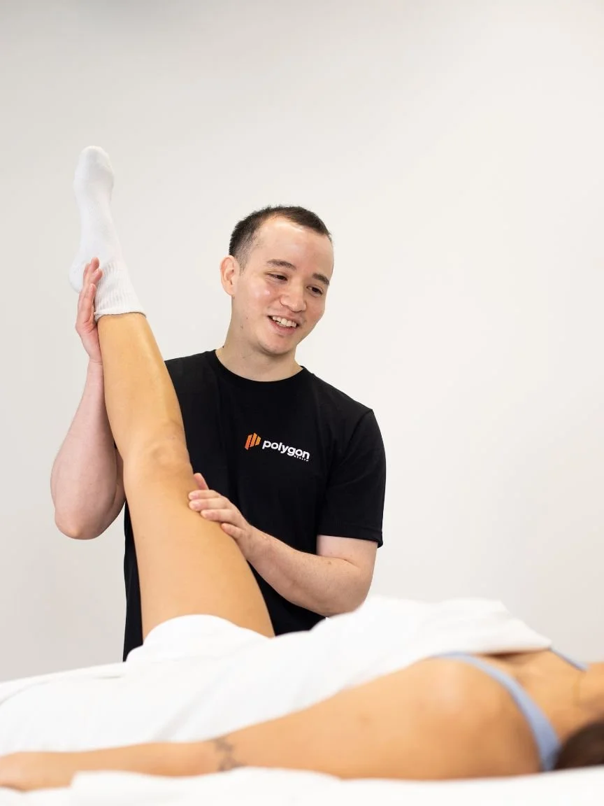 A woman providing neck therapy to a man lying on a chiropractic table.