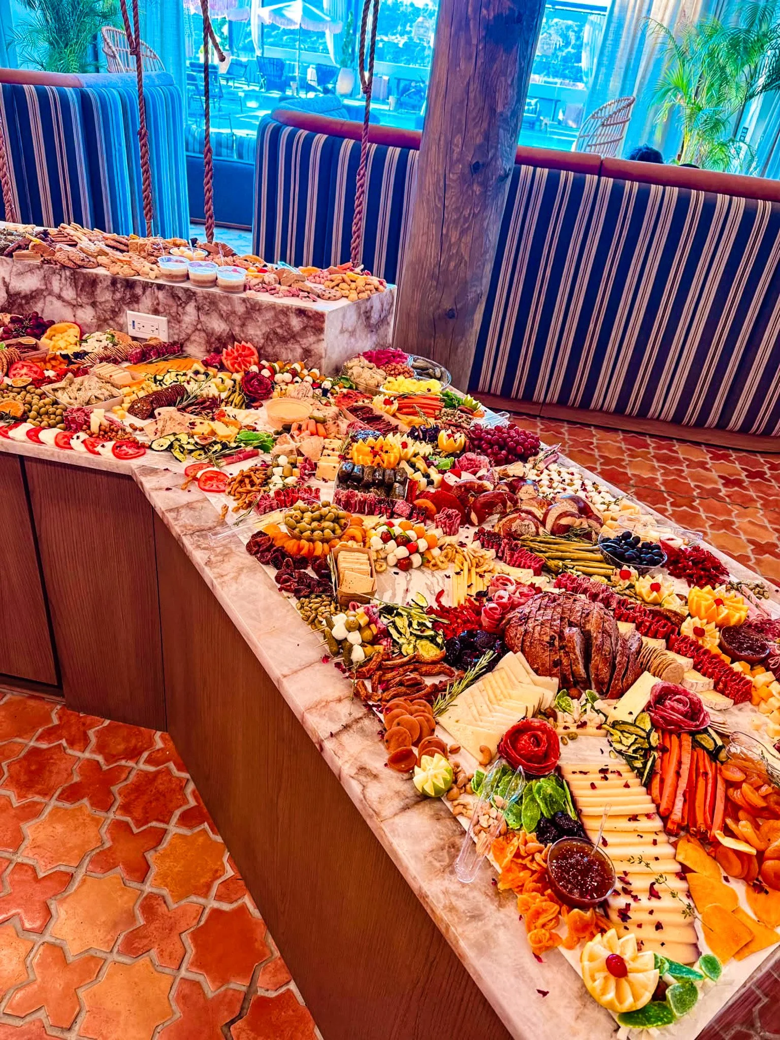A beautiful extra large grazing table from Brie & Burrata who offer catering for corporate, weddings, and parties in San Diego.