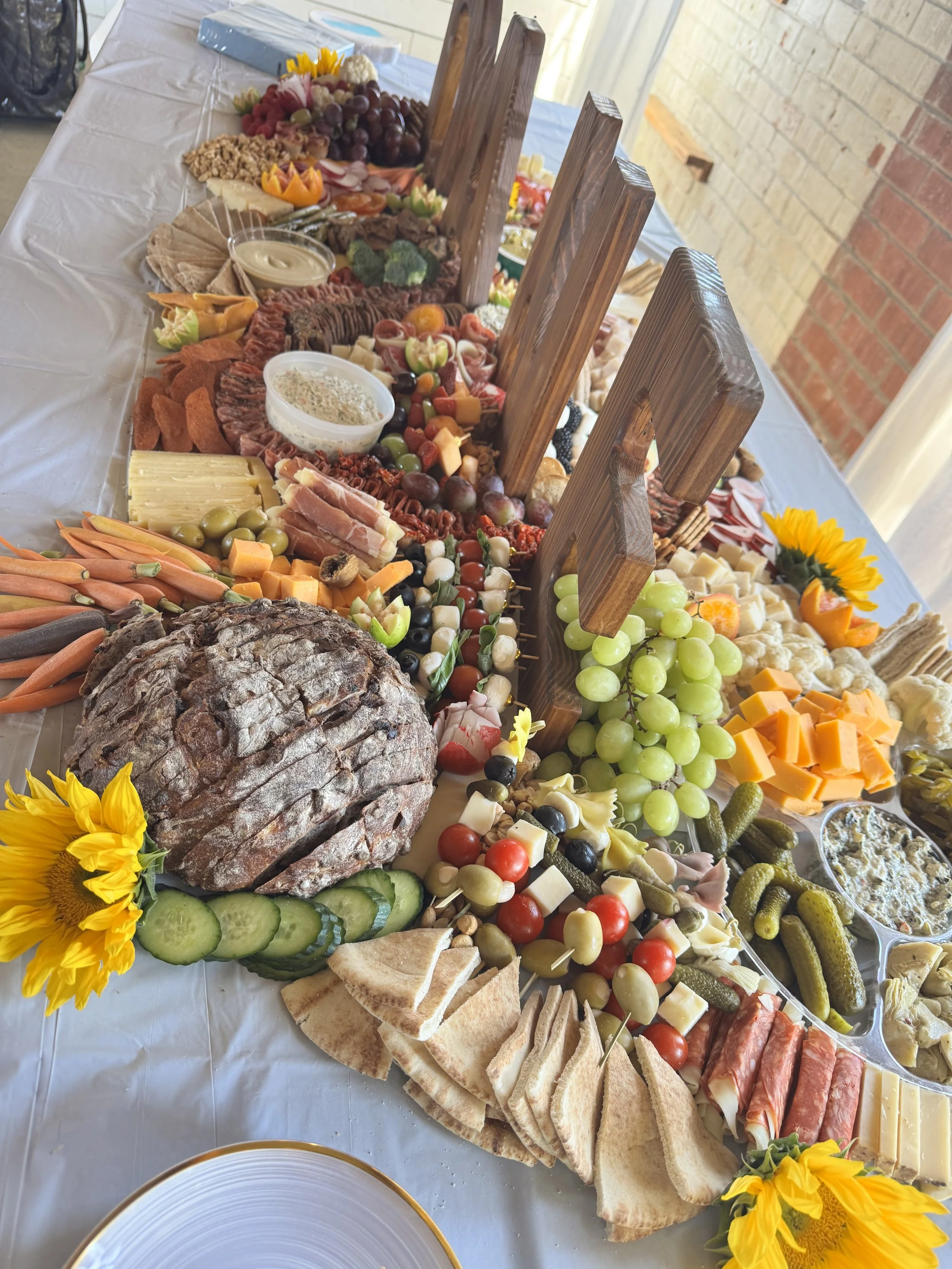 A luxurious grazing table made by Brie & Burrata for a baby shower in San Diego.