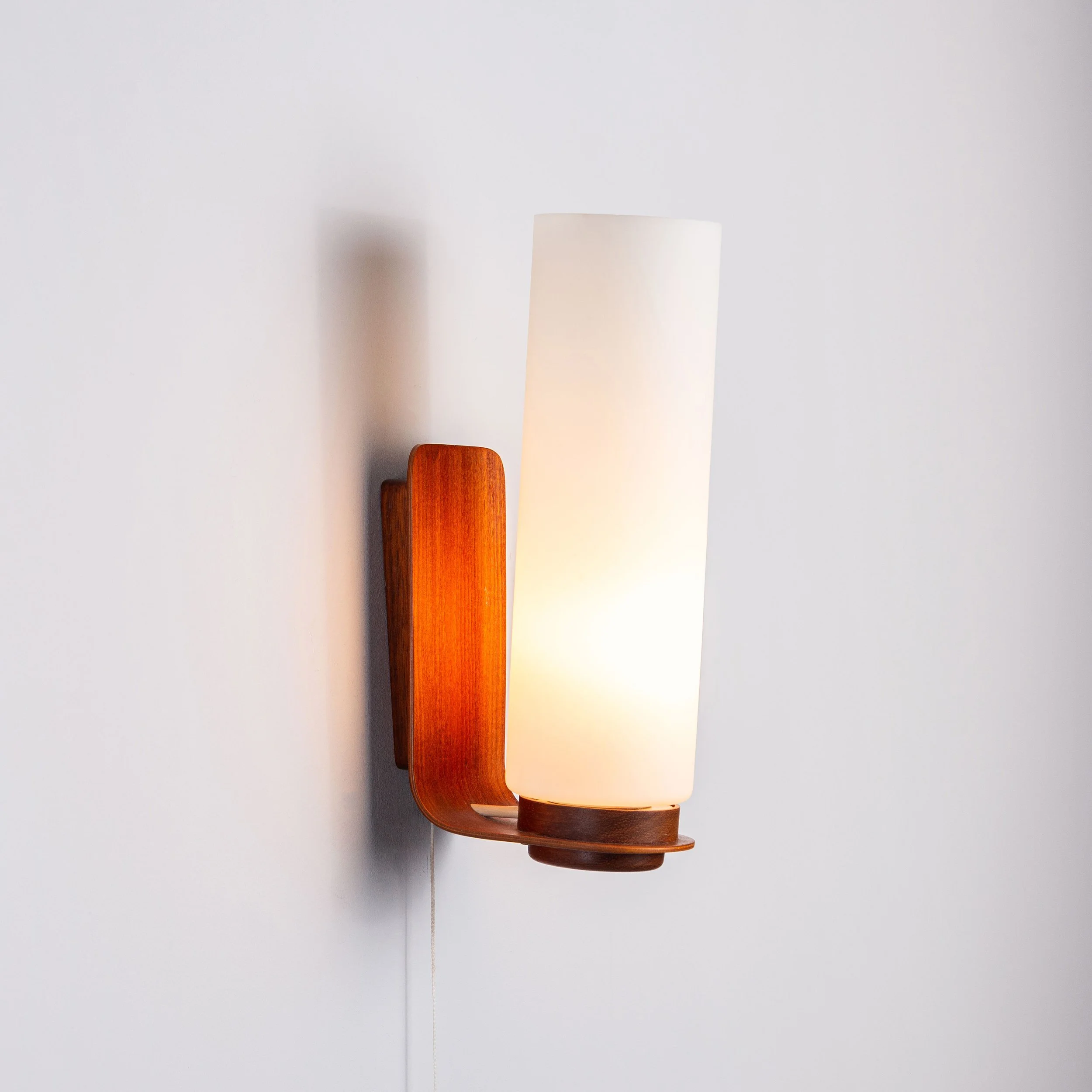 Cilindrical opal glass and bent wood wall lamp