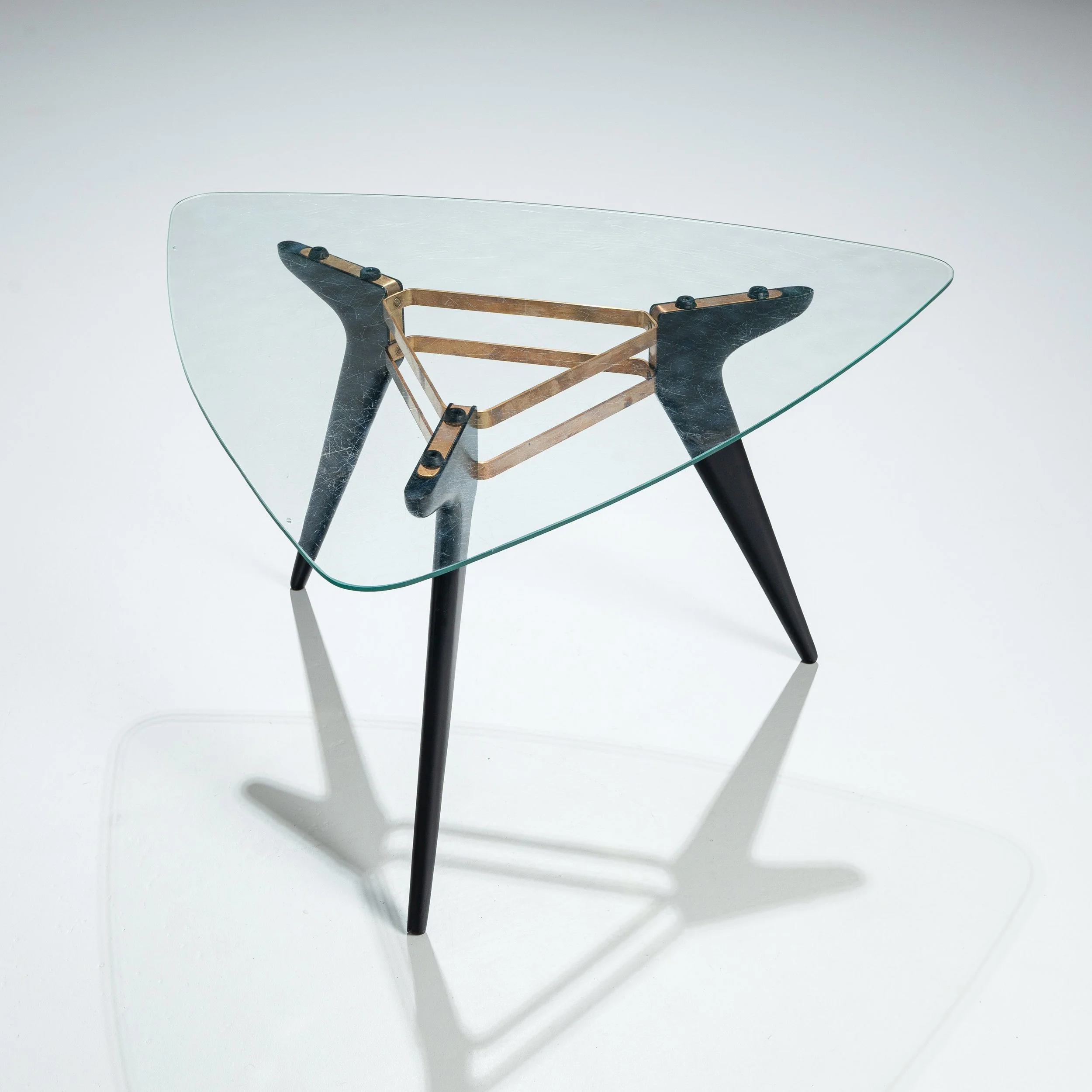 Triangular coffee table in the manner of Alfred Hendrickx