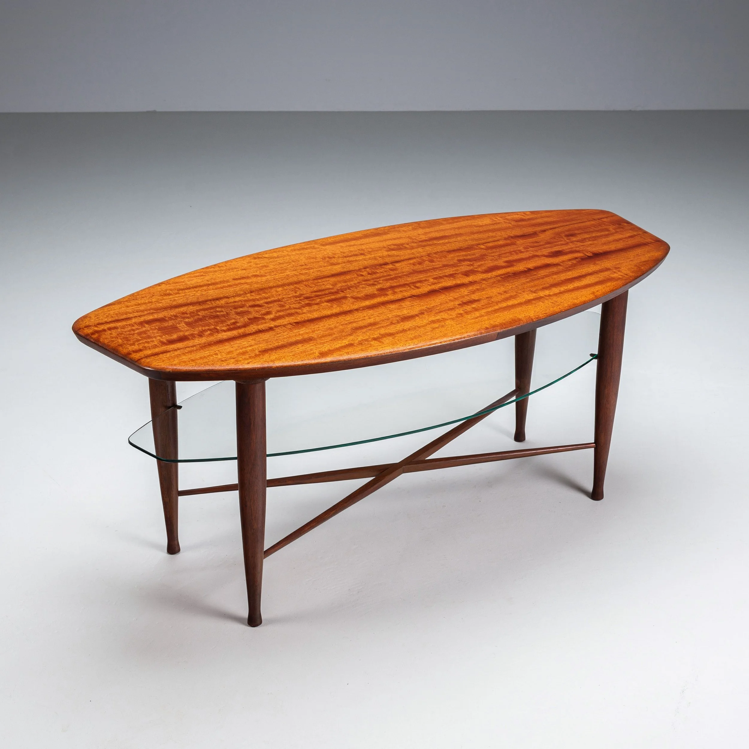 Assymetrical coffee table with glass storage and cross leg details