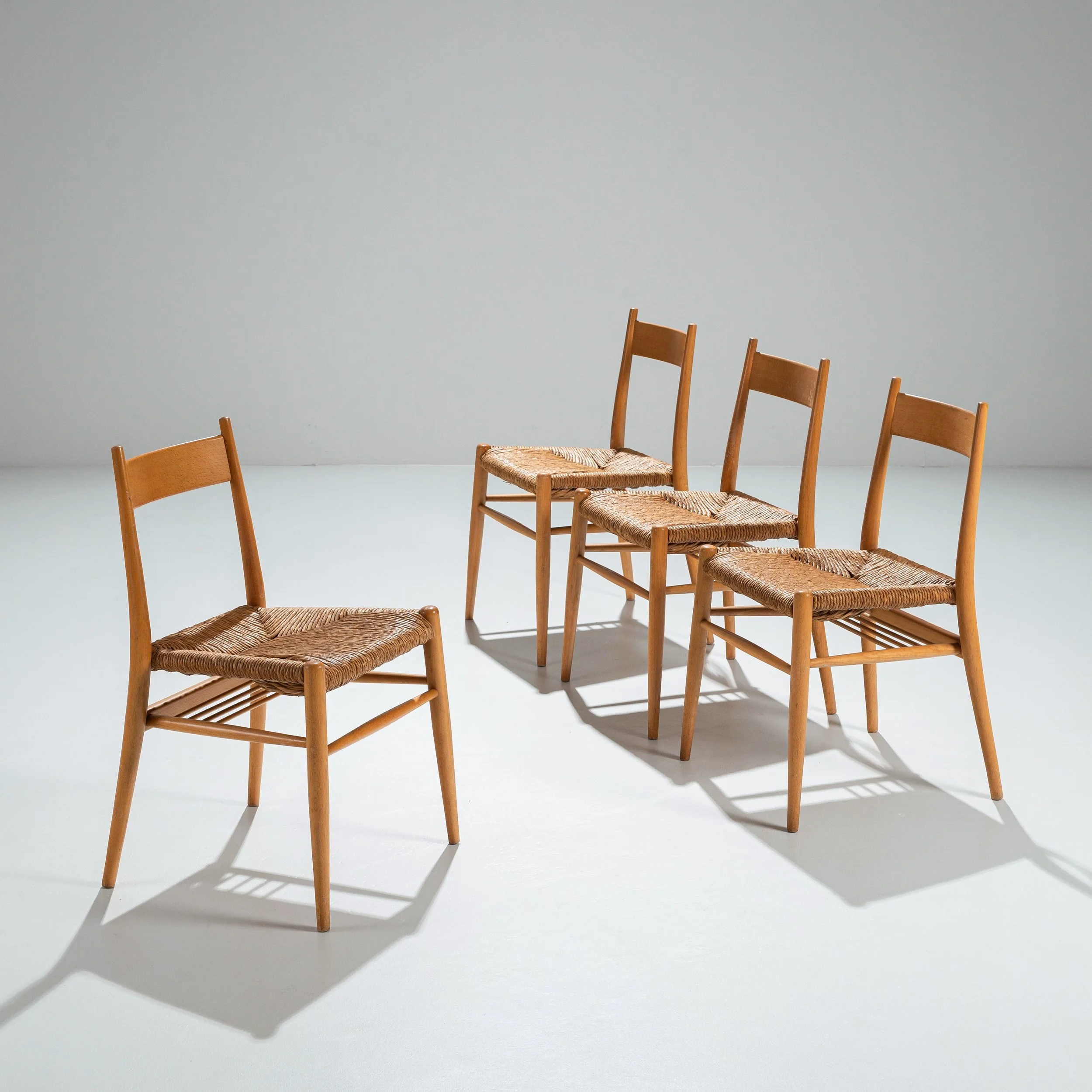 Four oak dining chairs with papercord seats