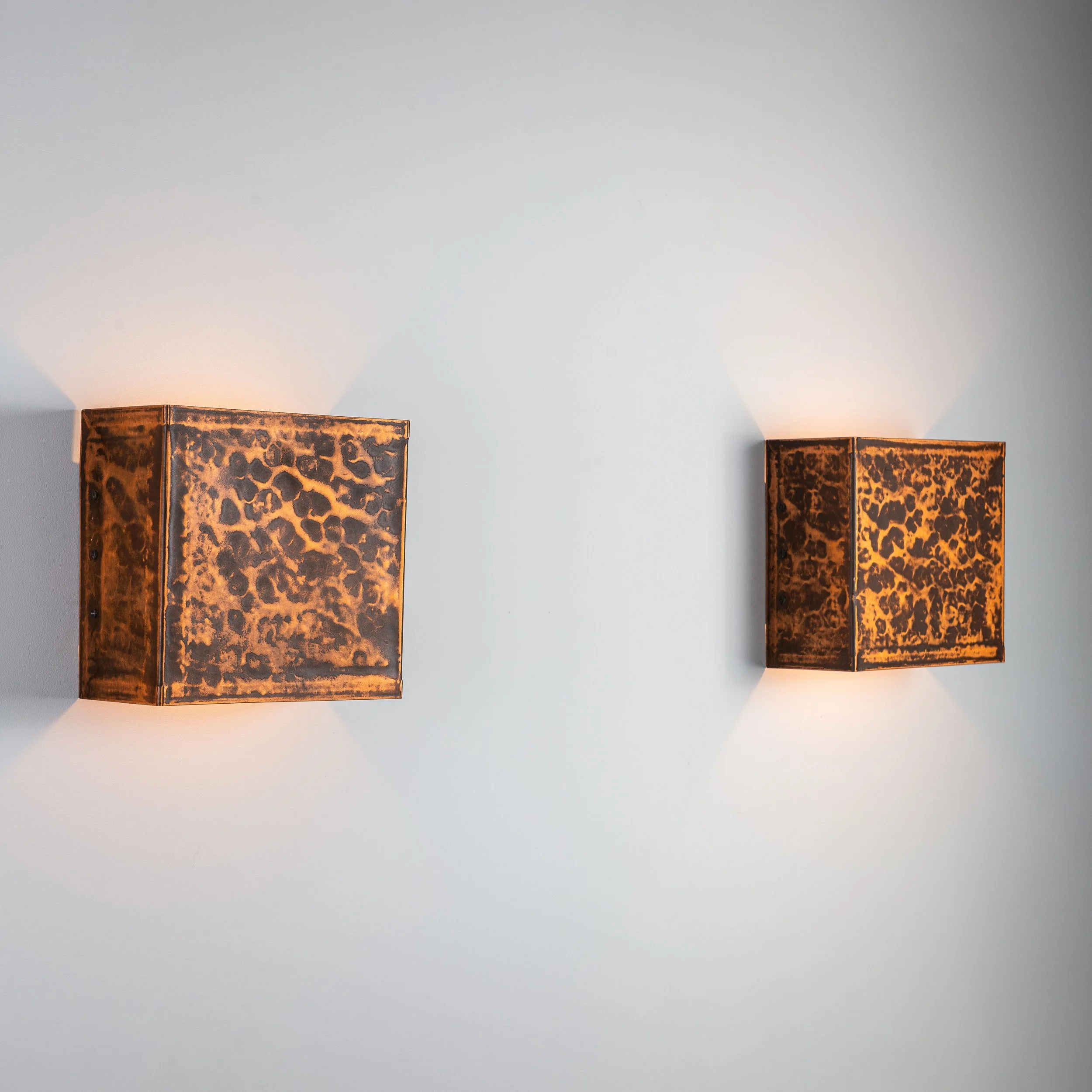 Pair of square textured brass wall lamps