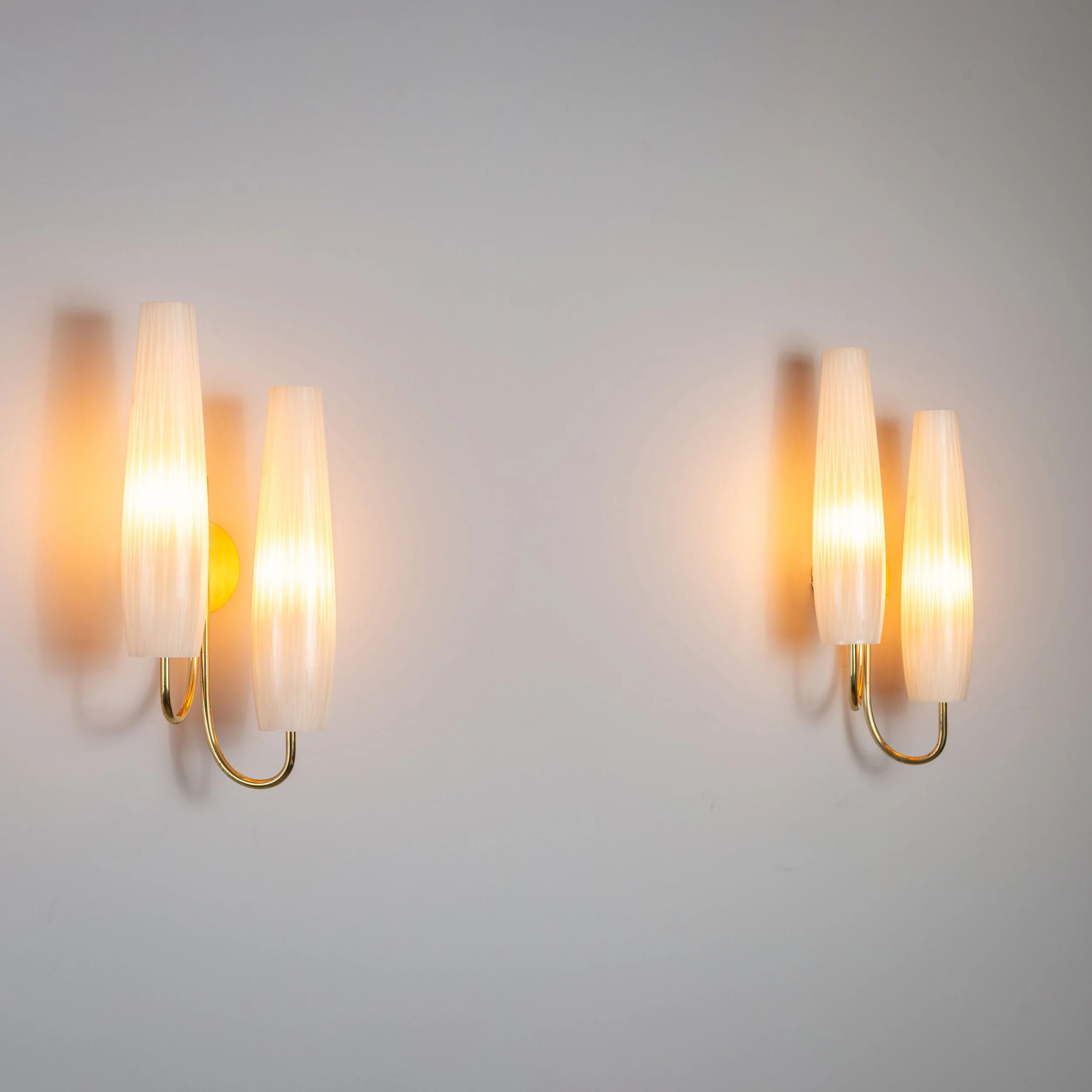 Pair of double shaded sconces with brass details