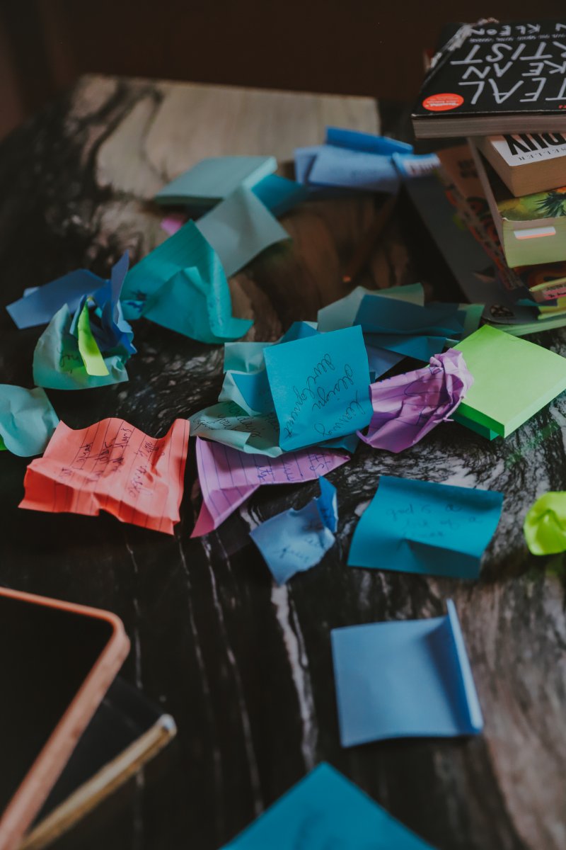 Crumpled sticky notes and scattered ideas... a visual reminder that more content isn't the answer when your sales messaging and content strategy aren't aligned with how buyers actually decide.