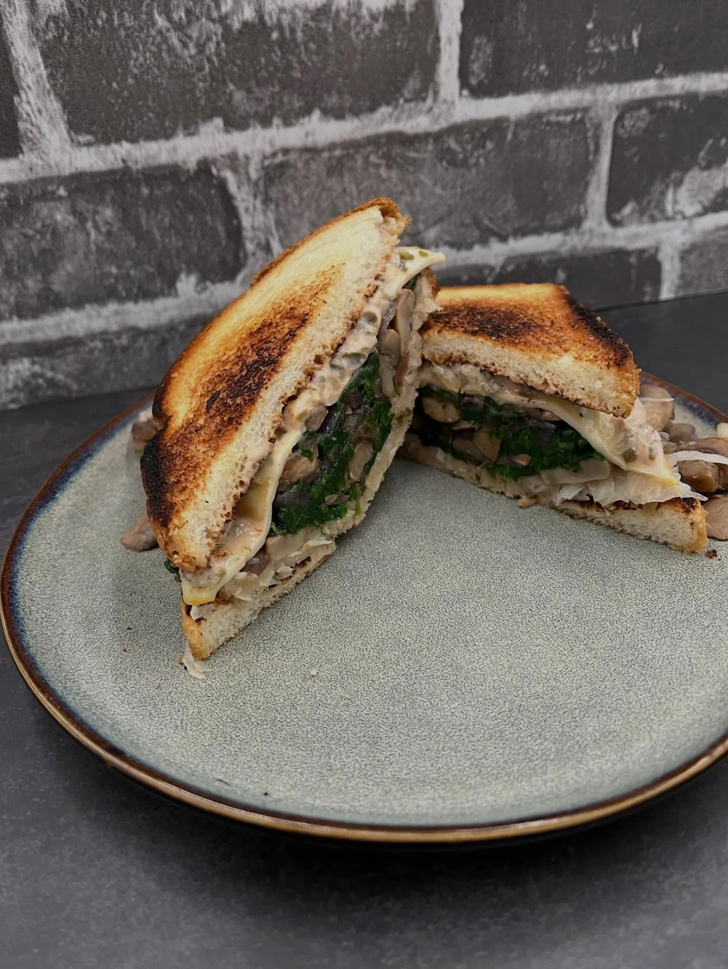 Vegetarian Reubens with mushrooms, spinach, Russian dressing, and Muenster cheese