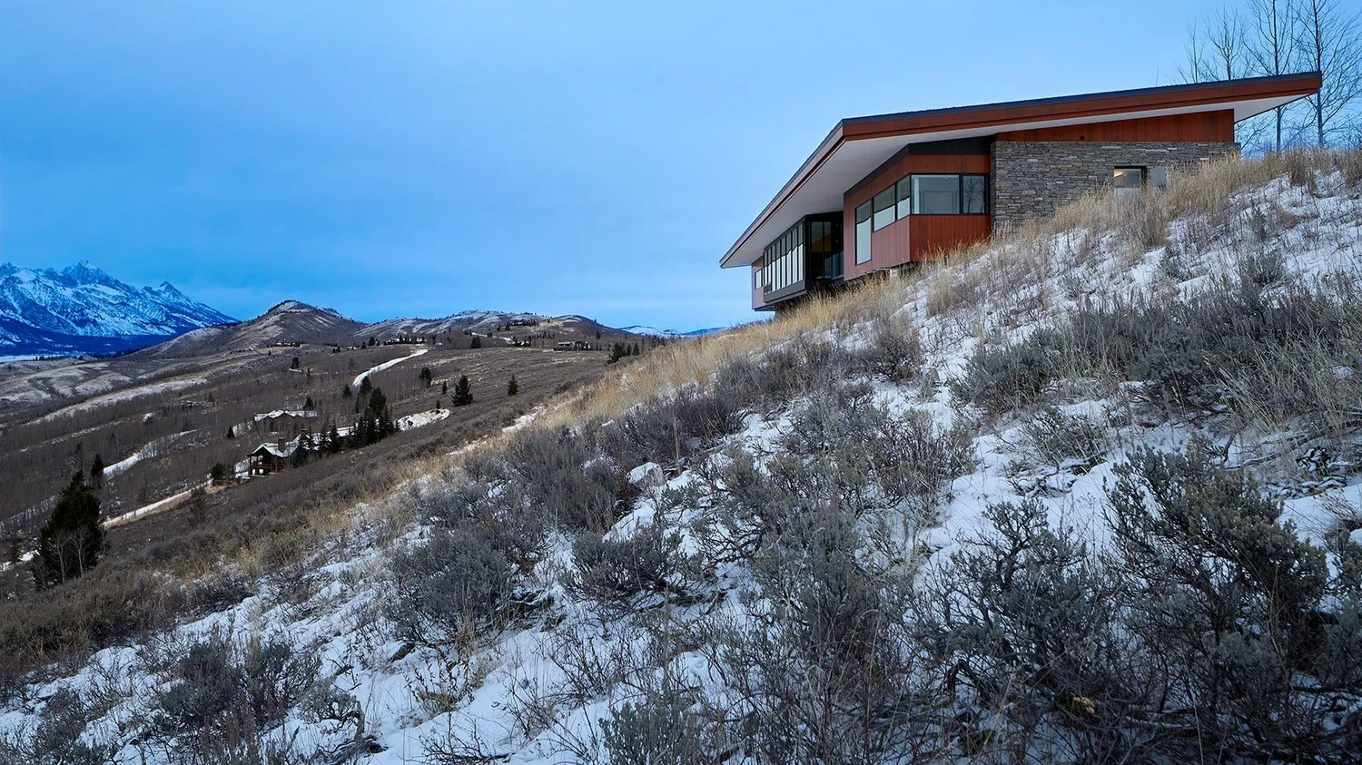 Green roof on the Ridgeline Residence blending into the ridgeline above Jackson Hole, Wyoming
