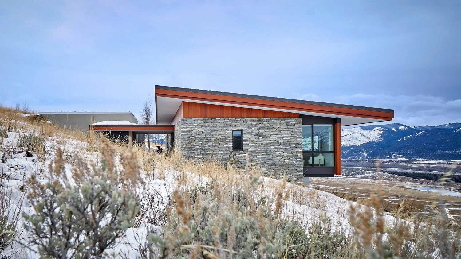 Ridgeline home set low along Gros Ventre Ridge with sage and native grasses in Jackson Hole