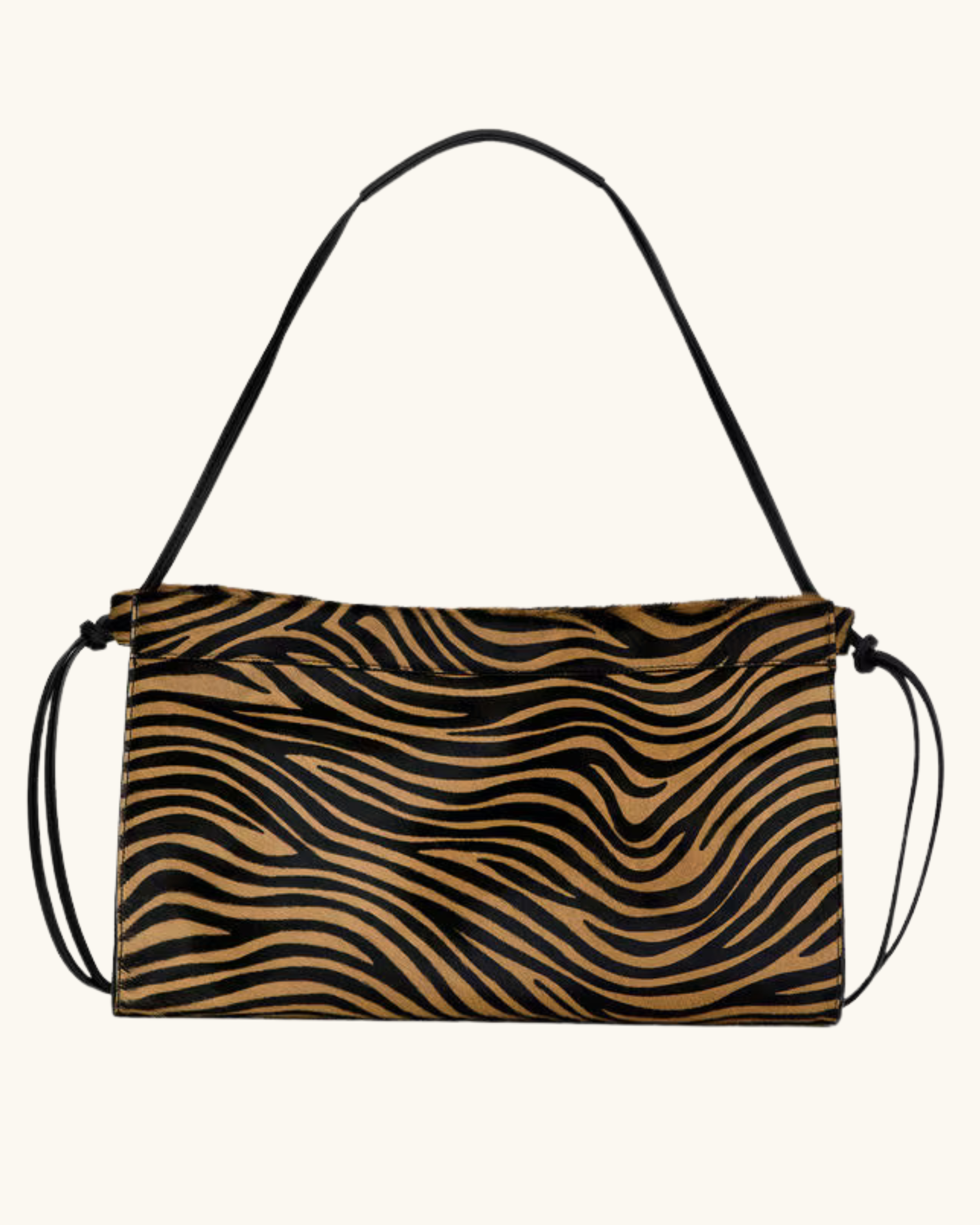 Sac à main avec motif zébré noir et brun, avec une poignée noire