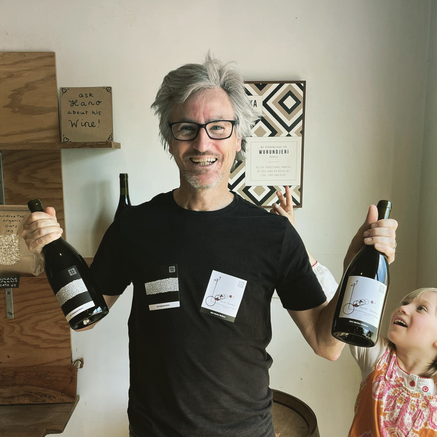 Winemaker, Andrew 'Hano' Hanson, and his helper showcasing his wares