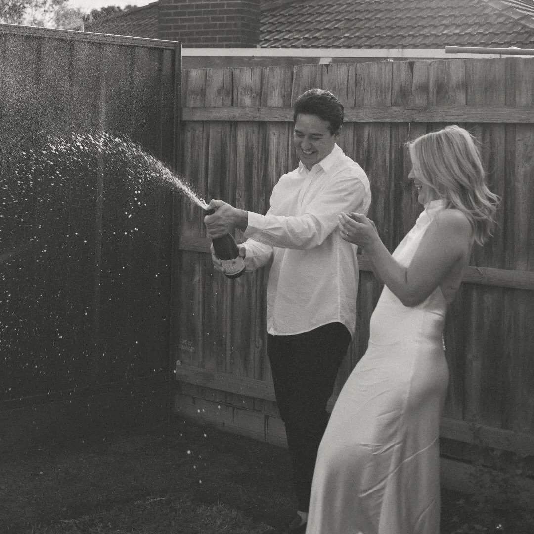 an at home elopement with just the two of them, their daughter and her parents as witnesses. 
a backyard champagne pop and a brother, doubled as next door neighbour, popping his head over the fence to see what all the fuss was about. 

kate and brad 