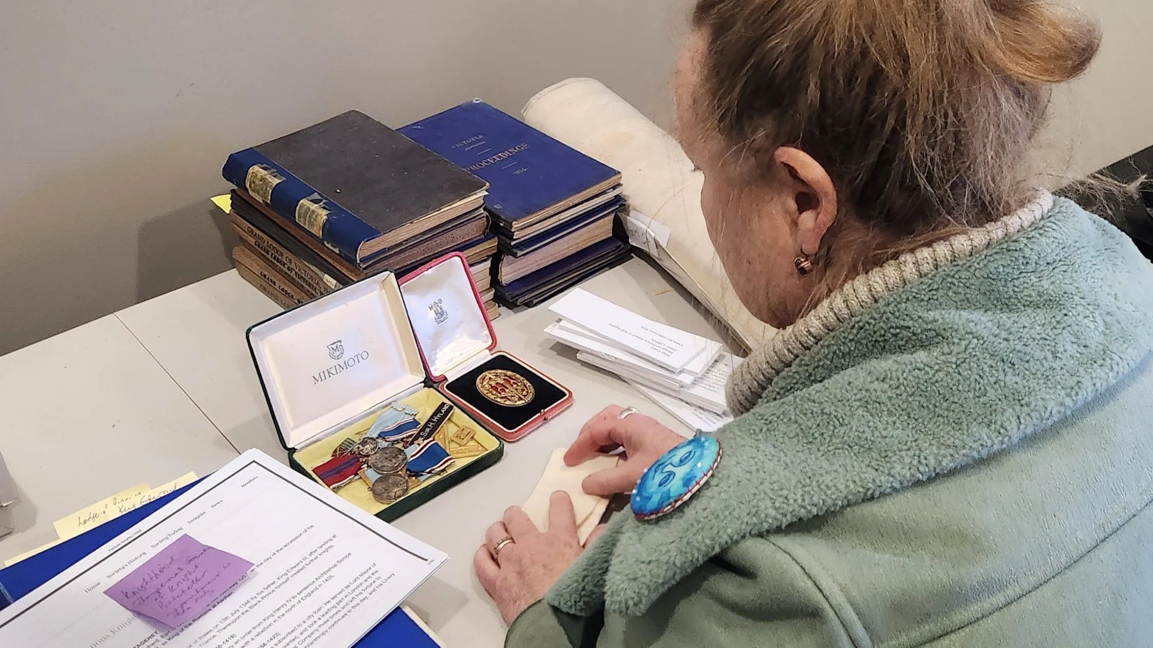  Internship | Samantha Fabrey showcasing some of the Masonic Centre’s collection items 