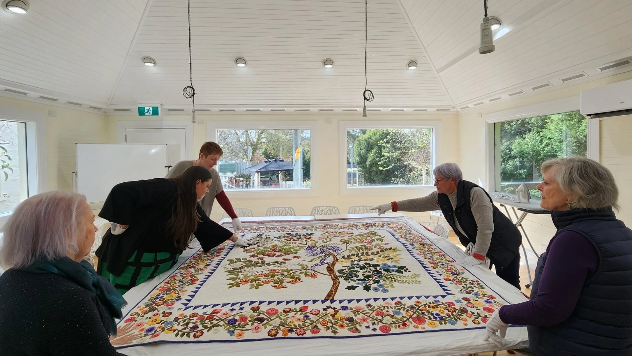  Programs &amp; PD | The AQTC team arranged  for our very own “Quilts of the Roundtable” experience 