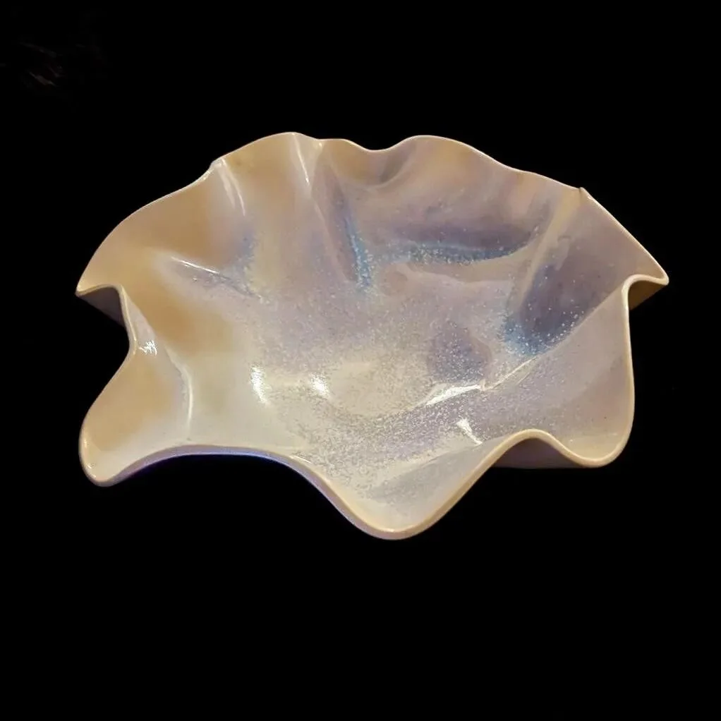 Fascinated with this new bowl. Love how the sprayed glaze pulls into the folds creating that iridescent glow. 
.
.
.
.
.
#pottersofbayarea #pottersofinstagram #handbuiltpottery #handmadepottery #handbuiltceramics #ceramicart #ceramicistsofinstagram