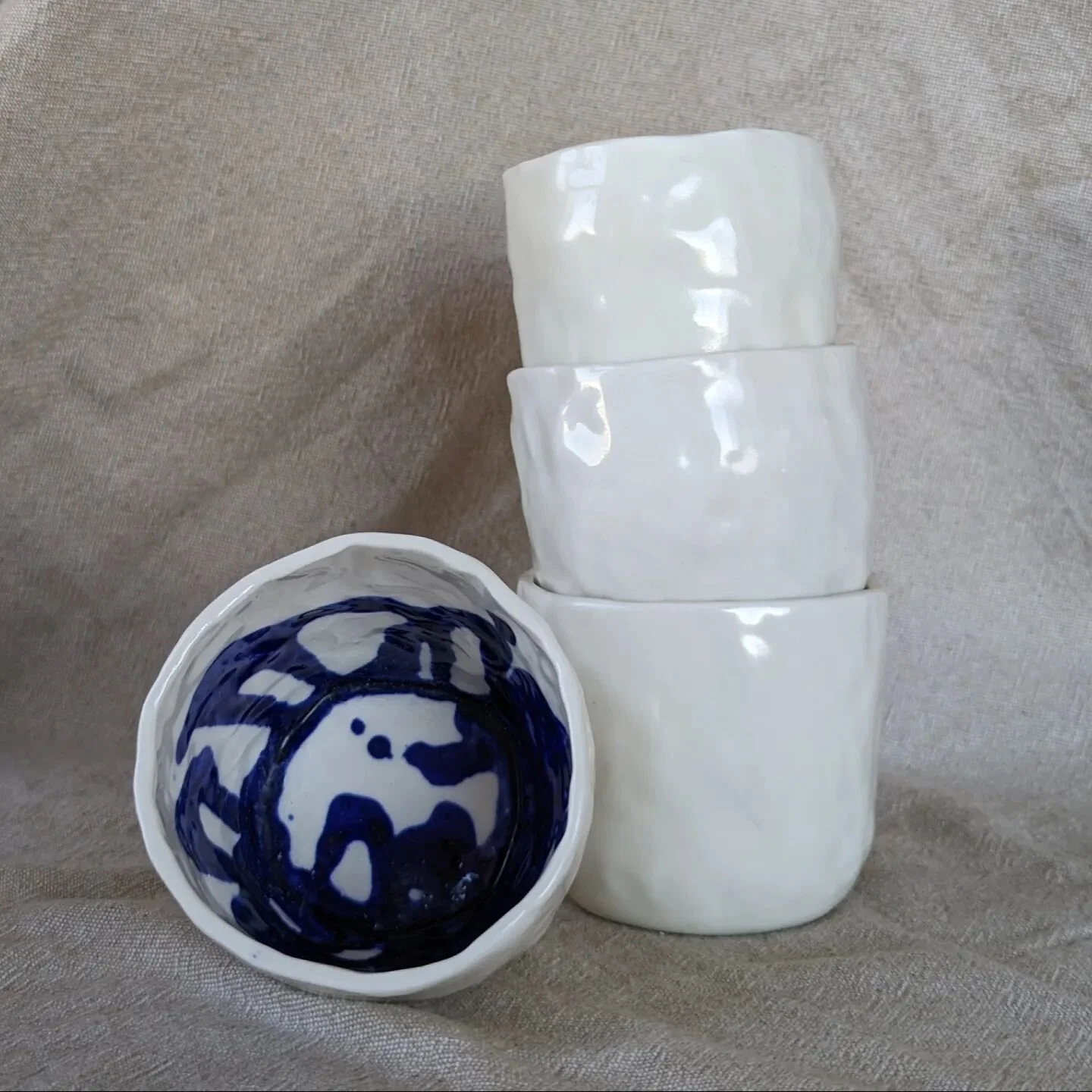 New cups alert! I have been exploring the idea of adding Rorschach-like spills to these hand built porcelain cups. It's fun to turn them around and see what associations come up. It's been quite a range of responses so far!

I'm excited to continue e