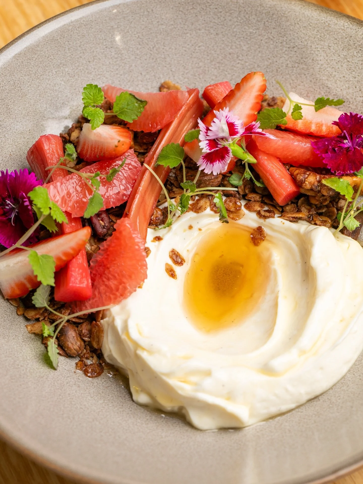 Made in house, the olive oil granola is just one element that makes this dish the quiet achiever on our menu. 

Crunchy and light, it&rsquo;s beautifully balanced with fresh seasonal fruits and a syrupy twist of orange blossom honey &ndash; truly sun