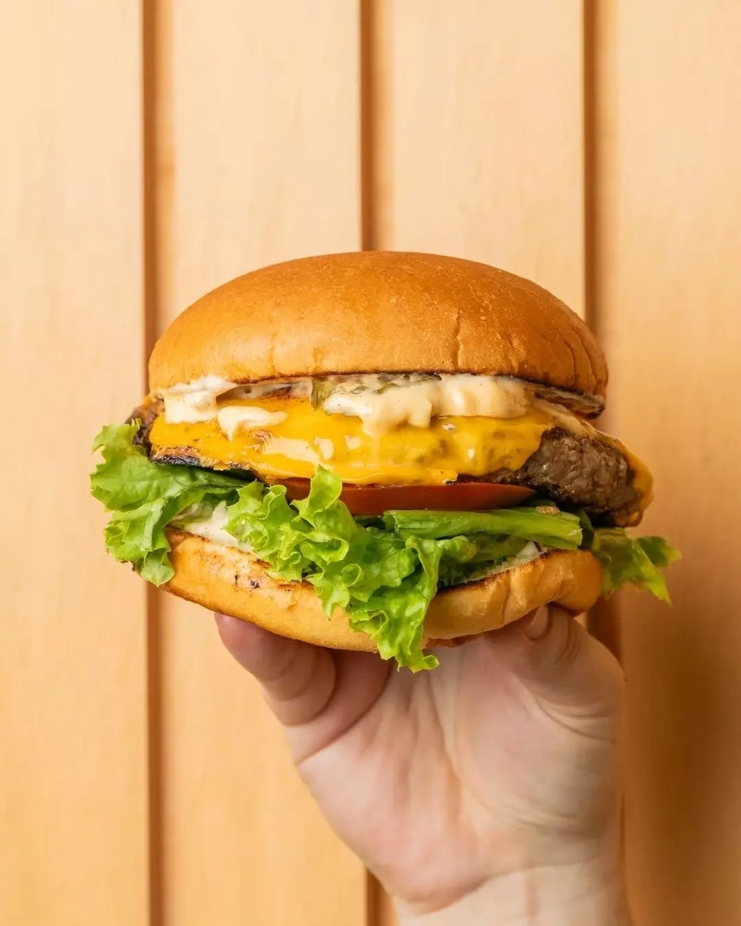 Juicy and fresh: this is a classic that's hard to beat.

Slathered in our signature Friction burger sauce, our Beef Burger stacks a 150g beef patty with American cheddar, lettuce, tomato and pickles on a soft potato bun, with chips on the side of cou