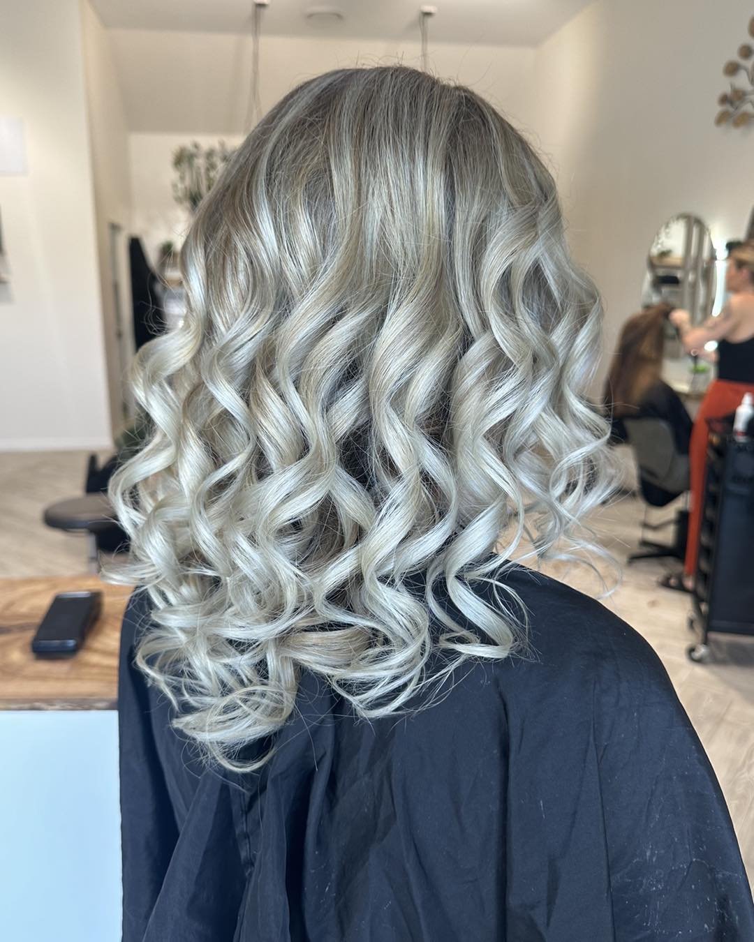 From dark to light! Achieved by applying baby lights mixed with slices with a blended root for easier maintenance. ✨✨✨ swipe ➡️➡️ for the before. ✨✨ created by Kirsty. 

#babylights #curls #blonde #creative #balayage #pure